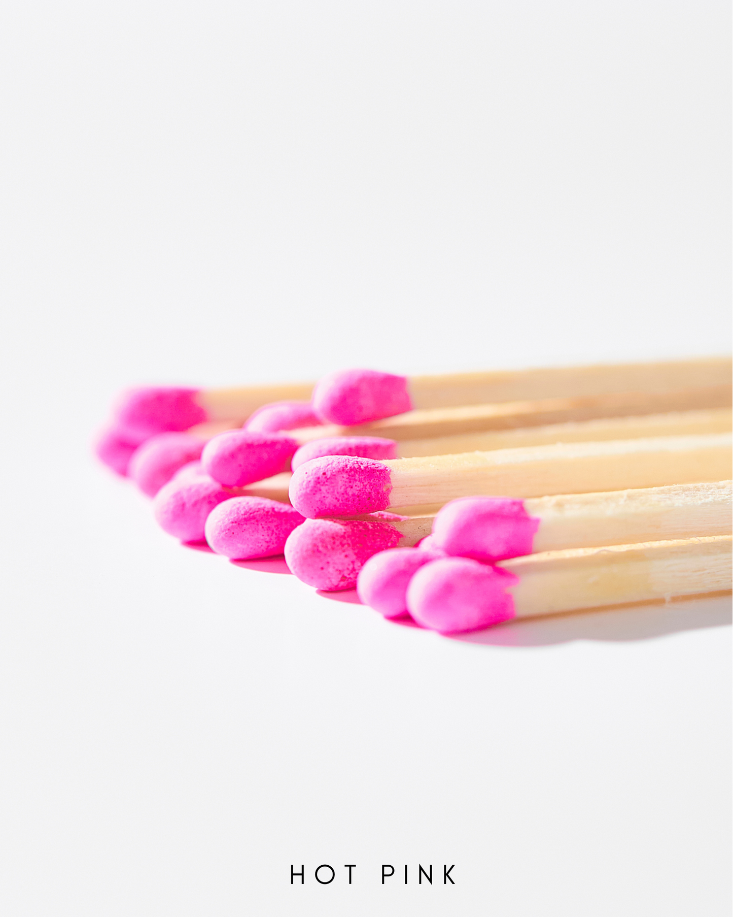 a close up of a group of pink matchesticks