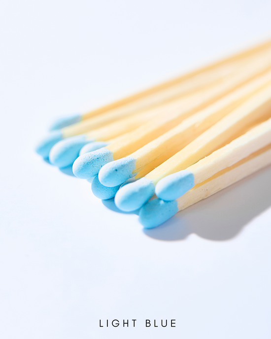 a group of blue and yellow toothbrushes on a white surface