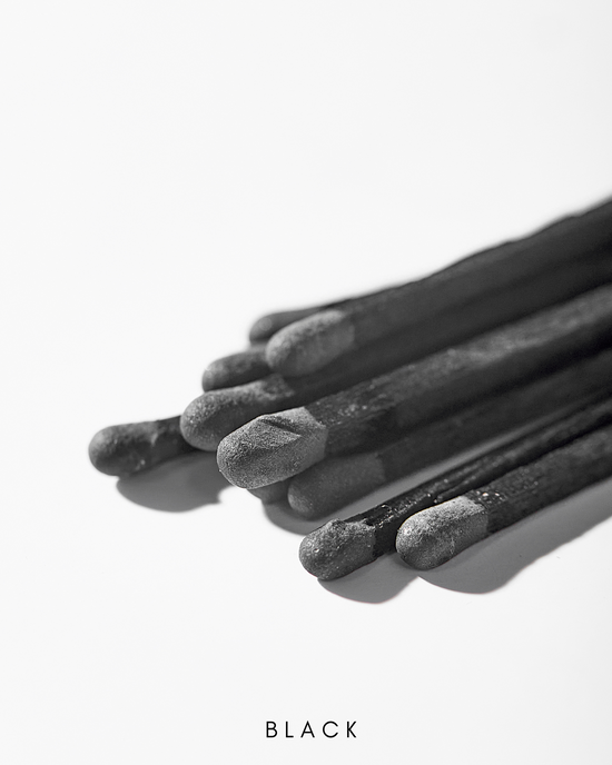 a close up of a bunch of black sticks