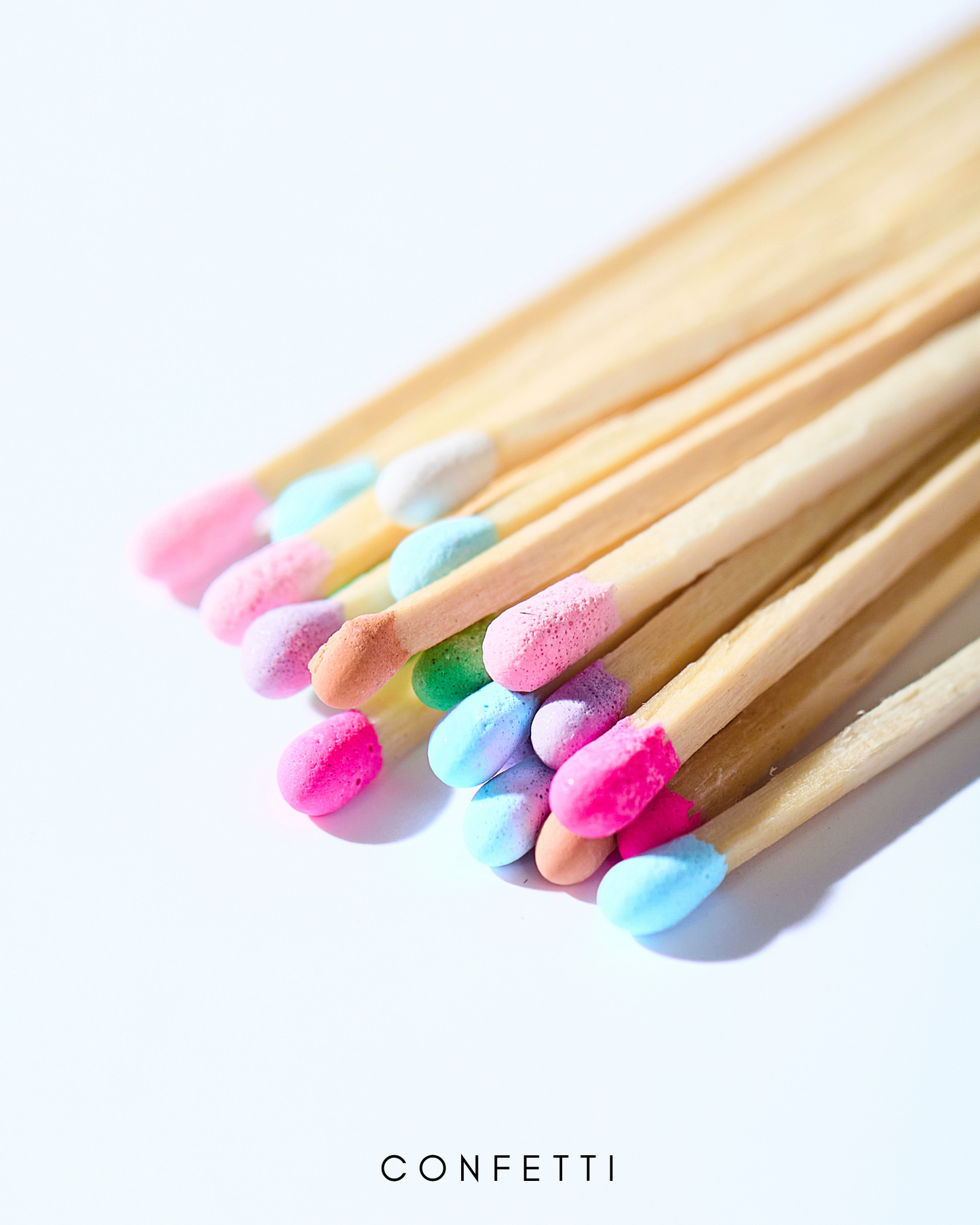 a close up of a bunch of toothbrushes on a white surface